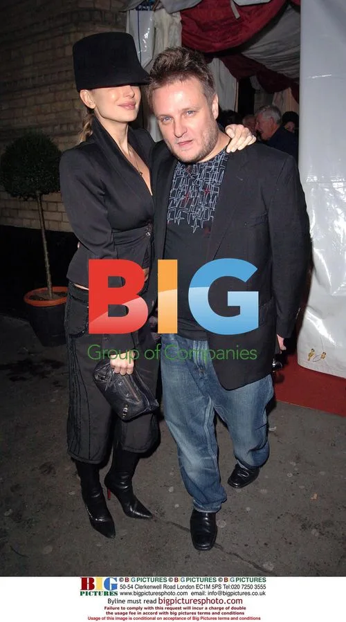 Photographer Rankin and partner at exhibition opening