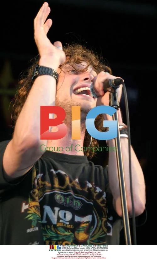 Singer NICK ATKINSON of ROOSTER on stage