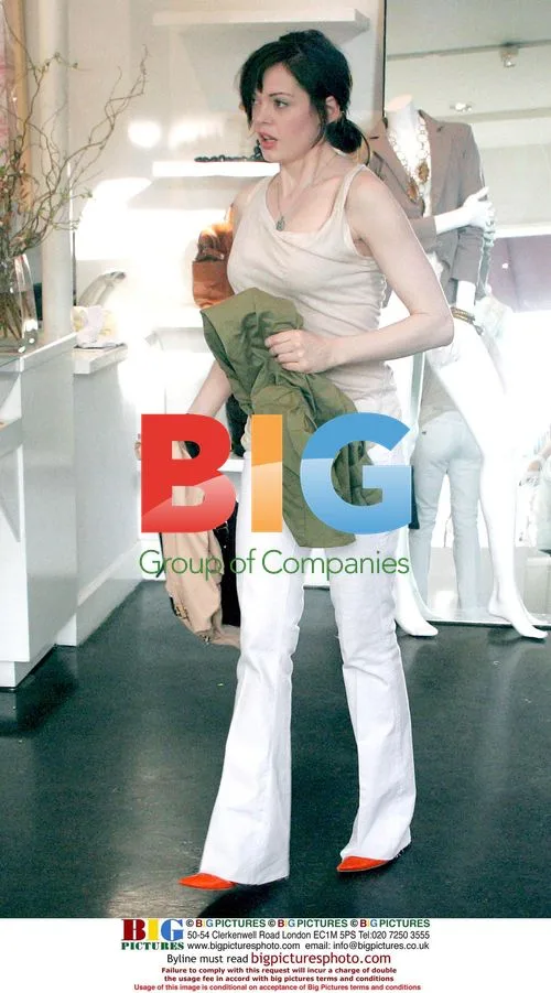 Rose McGowan Juggles Clothing While Shopping in Beverly Hills