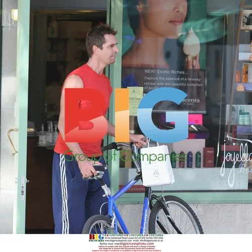 Rupert Everet Rides Bicycle in Miami