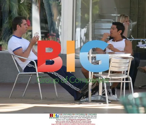 Rupert Everett relaxes with friend in Miami