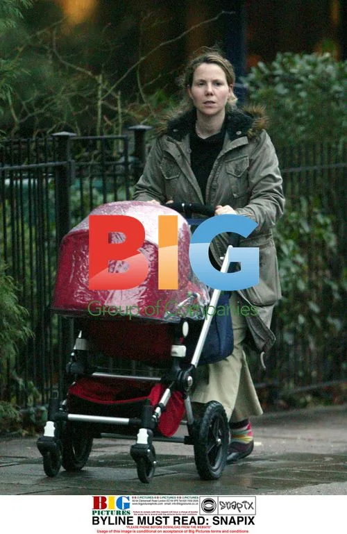 Sally Philips takes child for stroll