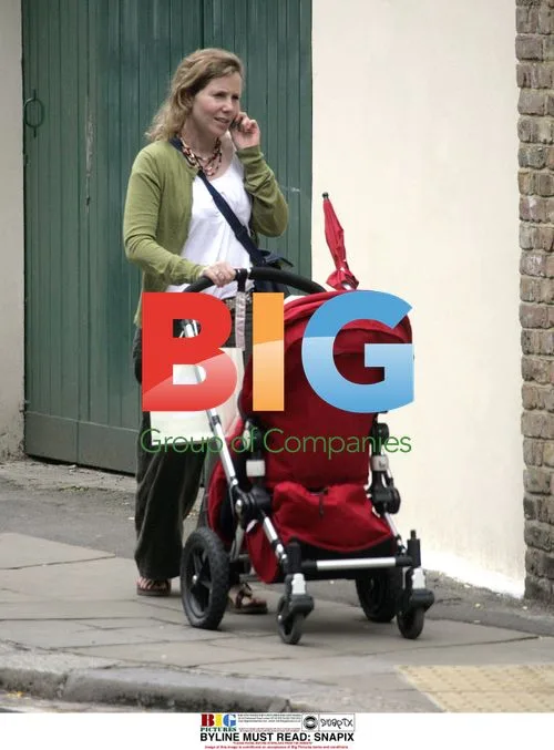 Sally Philips takes baby for stroll in London